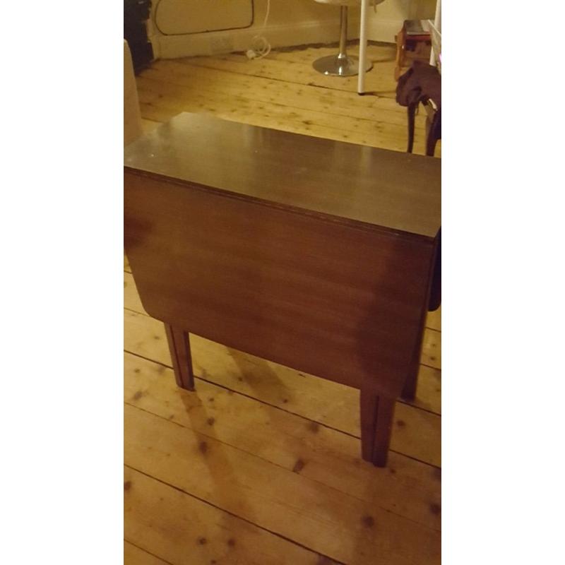 Dark wood dining table fold down great condition.