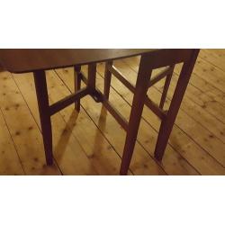 Dark wood dining table fold down great condition.