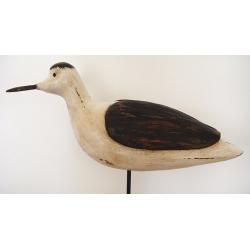 Large carved wooden bird on stand