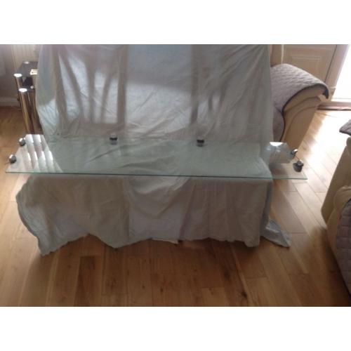 Three glass shelves with six brackets with each shelve
