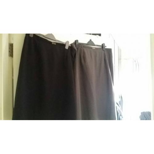 Two knee length smart straight skirts