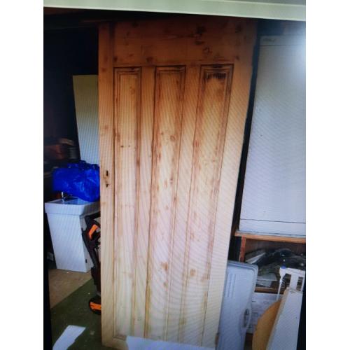 Vintage panelled pine door with lock and key