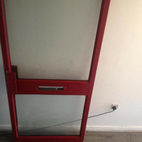 Aluminium shop door with door handles.