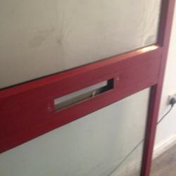 Aluminium shop door with door handles.