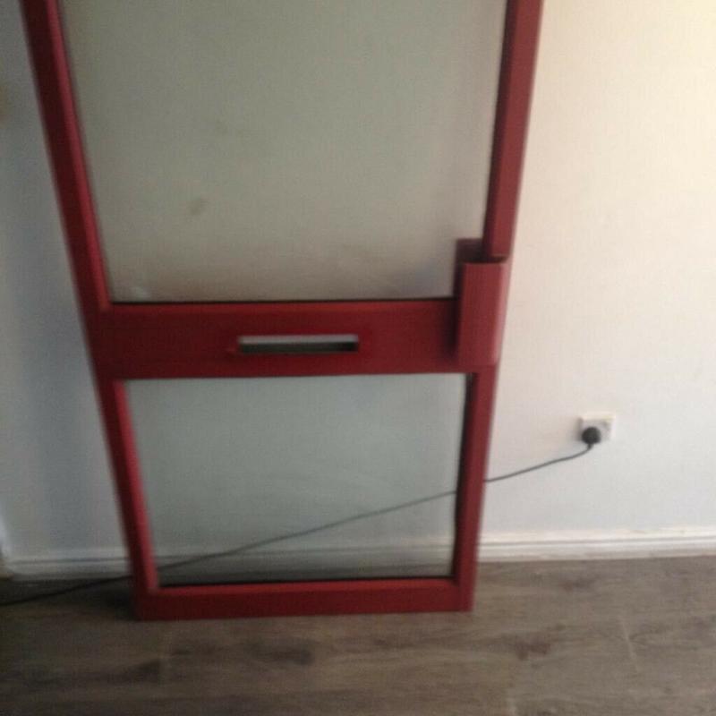 Aluminium shop door with door handles.