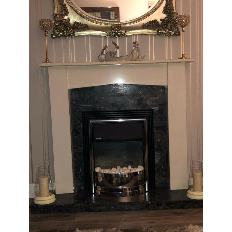 FIRE SURROUND ON BLACK MARBLE HEARTH AND BACK