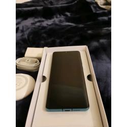 Huawei P30 pro 128GB with wireless charging pad.