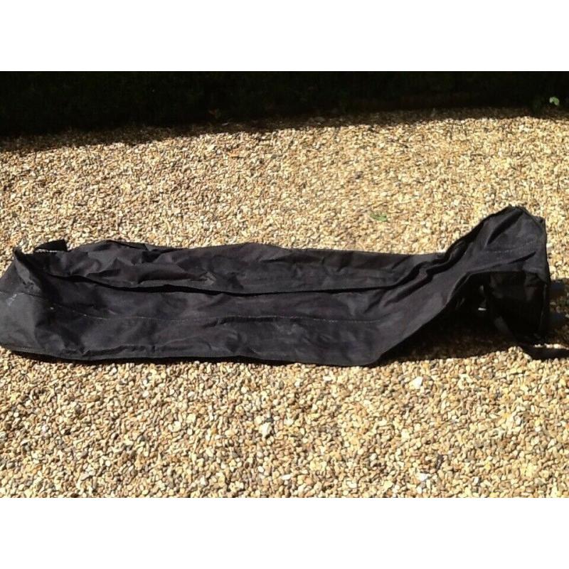 Black ski bag with wheels, 5ft in length.