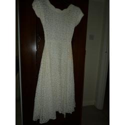 Vintage 1950s lace satin-lined wedding dress with fitted bodice and full skirt, calf / ankle length