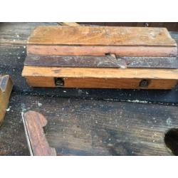 A collection of vintage hand moulding planes