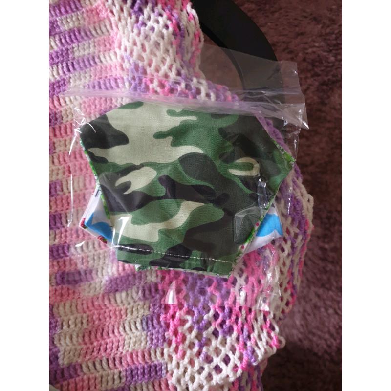 Sealed pack of four sanitized face masks